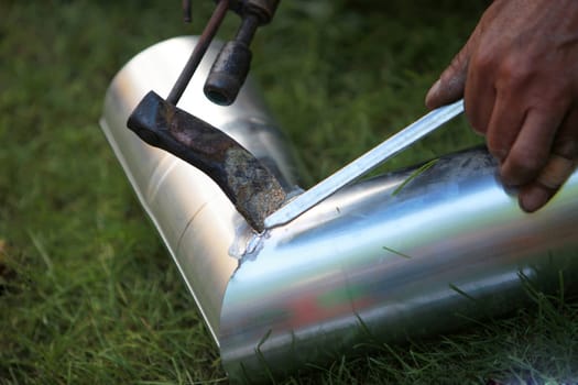 A downpipe for a roof is welded