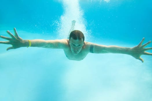 Man swimming under water