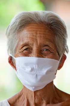 old asian woman with face mask