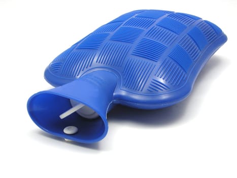 Blue hot water bottle against white background