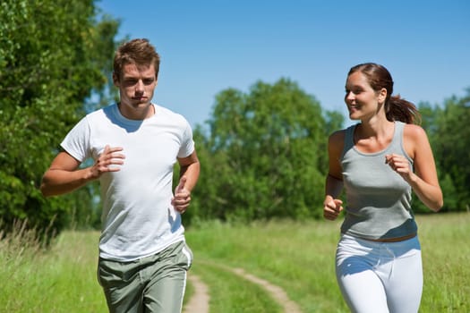 Young man and woman jogging