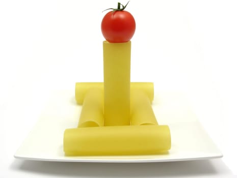 Several uncooked cannelloni on a plate