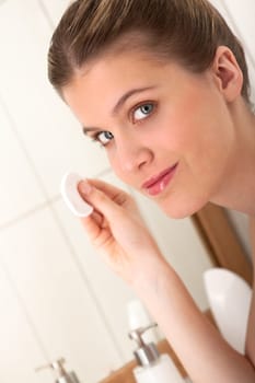 Body care- Woman holding cotton pad