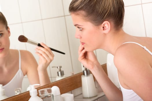Body care series - Woman applying powder