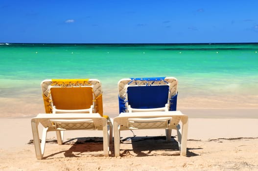 Chairs on sandy beach