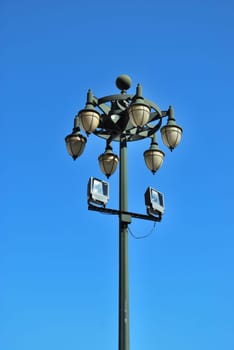 Ancient lamp on sidewalk