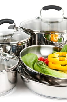 Stainless steel pots and pans with veget