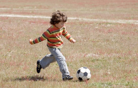 Child playing football