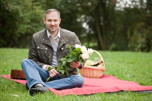 Man with flowers waiting for girlfriend