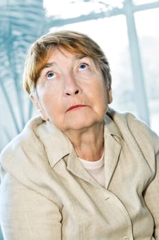 Elderly woman looking up