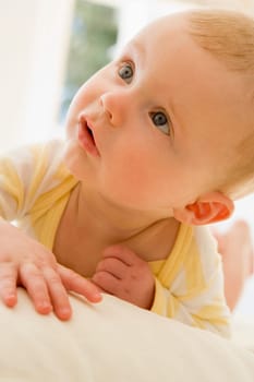 Baby lying indoors