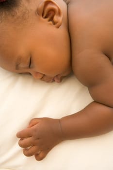 Baby lying indoors sleeping