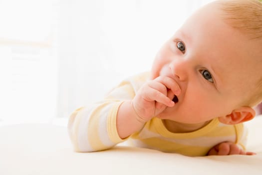 baby lying indoors