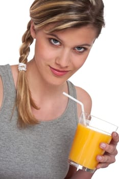 Healthy lifestyle series - Woman holding glass of orange juice