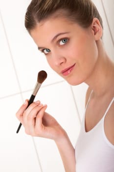 Body care series - Woman applying powder