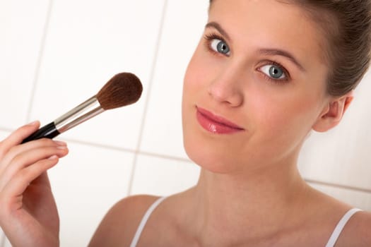Body care series - Woman applying powder