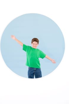 Young boy standing with arms out smiling