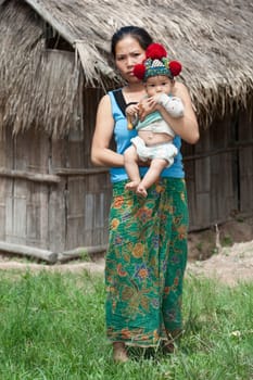 Laos,Asian mother with baby of Yao ethnic group
