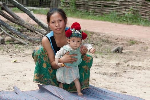 Laos,Asian mother with baby of Yao ethnic group