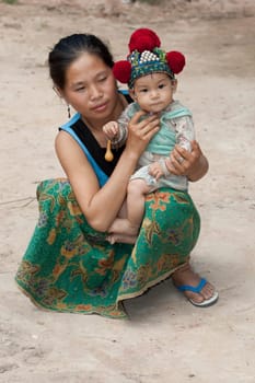 Laos,Asian mother with baby of Yao ethnic group