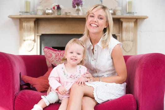 Mother in living room with baby smiling