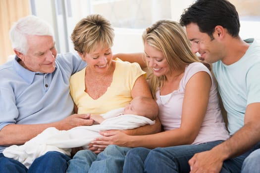Family in living room with baby smiling