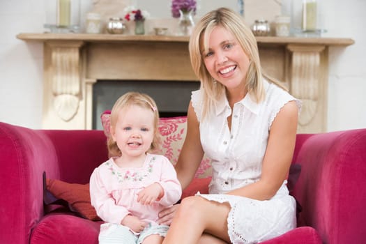 Mother in living room with baby smiling