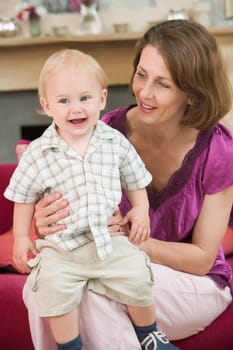 Mother in living room with baby smiling