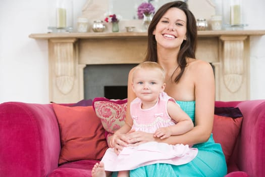 Mother in living room with baby smiling