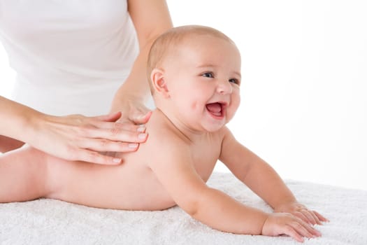 Mother massaging baby