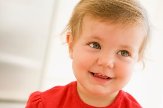 Baby indoors smiling