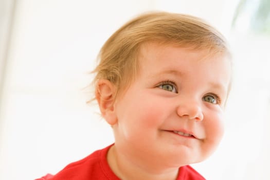 Baby indoors smiling