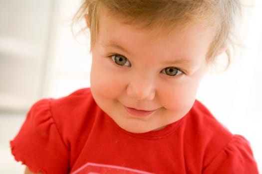 Baby indoors smiling