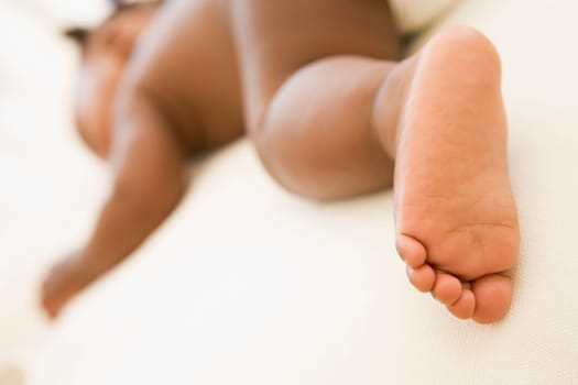 Baby sleeping with focus on foot