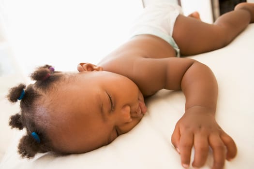 Baby sleeping in bedroom