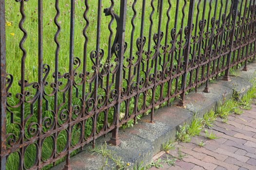 Old wrought iron metal garden fence