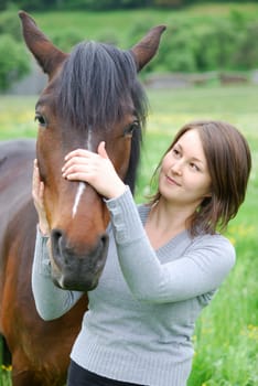 Young woman with horse