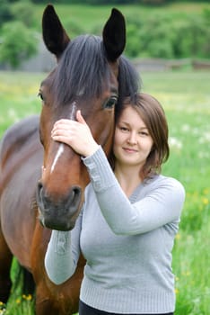 Young woman with horse