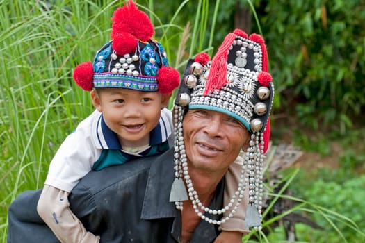 Man with child in Thailand,Akha