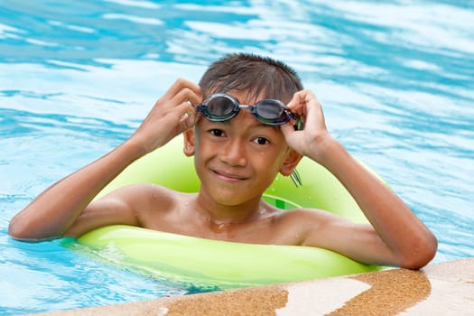 Child with swimming ring in the water