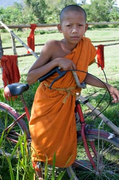 Buddhist monk on bicycle