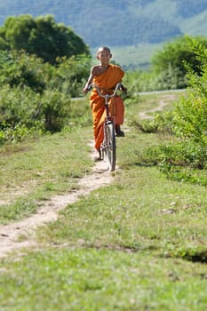 Buddhist monk on bicycle