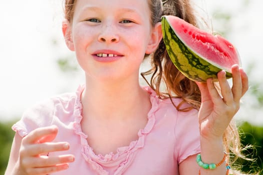 Little girl and her watermelon