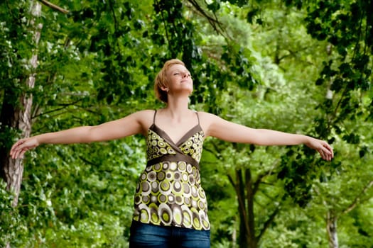 blond girl flying in the forest