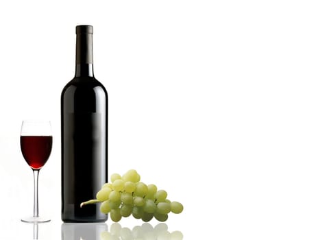 Bottle of red wine, glass and grape