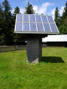 Solar system on wooden stand on meadow in Bavarian Forest