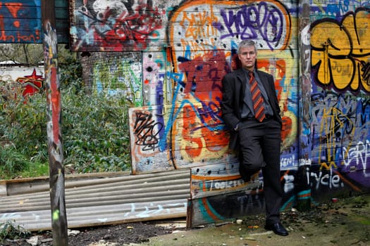 Man in Suit at Grafity Wall