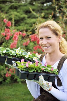 Young woman holding seedlings