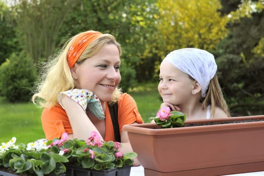 Mother, daughter having gardening time