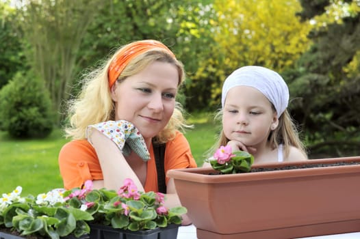Mother and daughter having gardening tim